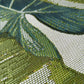 Close-up of a woven fabric with green, white, and blue pattern