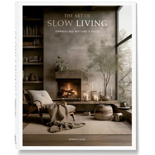 Book cover of 'The Art of Slow Living' with a cozy living room scene.