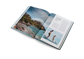 Open book showing a scenic view of a beach with people and text on a white background