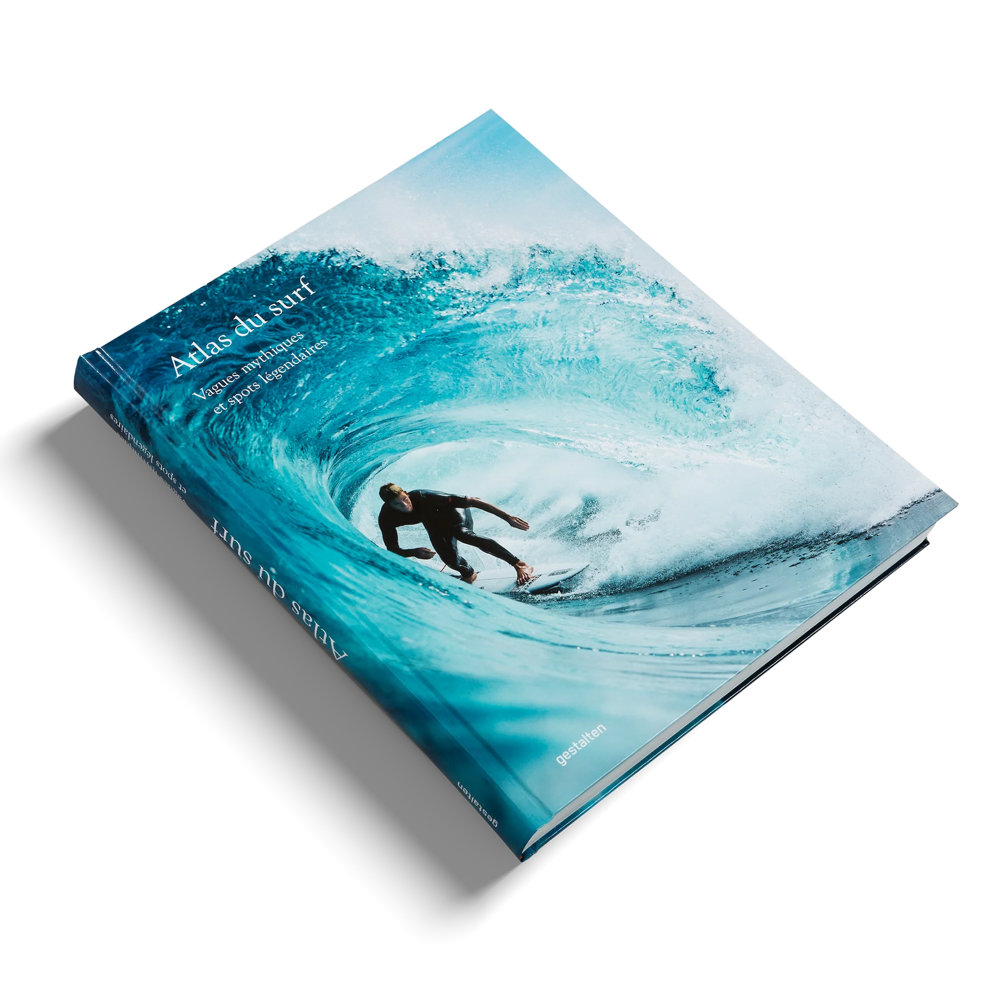 Book titled 'Atlas du surf' with a surfer on a wave cover on a white background