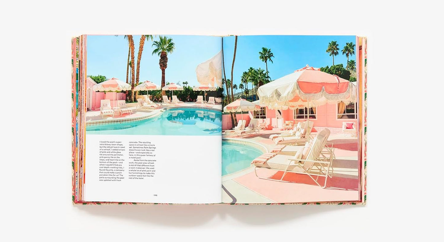 Open book showing a pool scene with pink cabanas and palm trees.