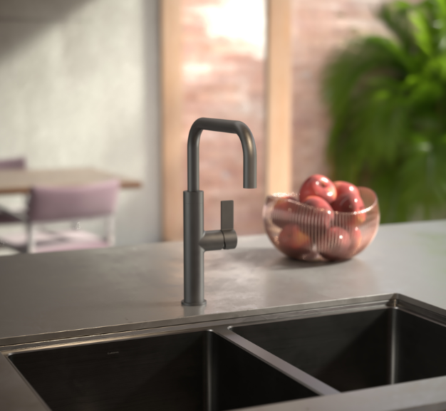 Black kitchen faucet on a countertop with apples in the background