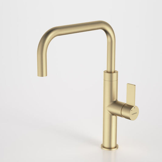 Gold kitchen faucet on a white background