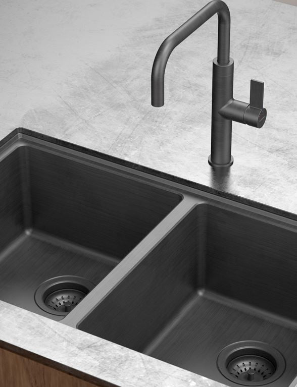Black kitchen sink with a modern faucet on a gray countertop