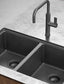 Black kitchen sink with a modern faucet on a gray countertop