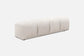 Cream fabric ottoman/bench in 4 padded stitched sections