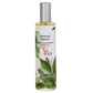 Room spray bottle with green leaf design and white label on a white background