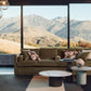 Modern living room with a view of mountains through large windows