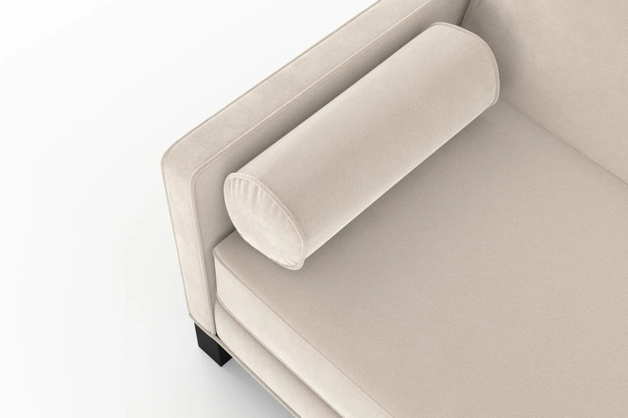 Beige sofa with curved armrests on a white background