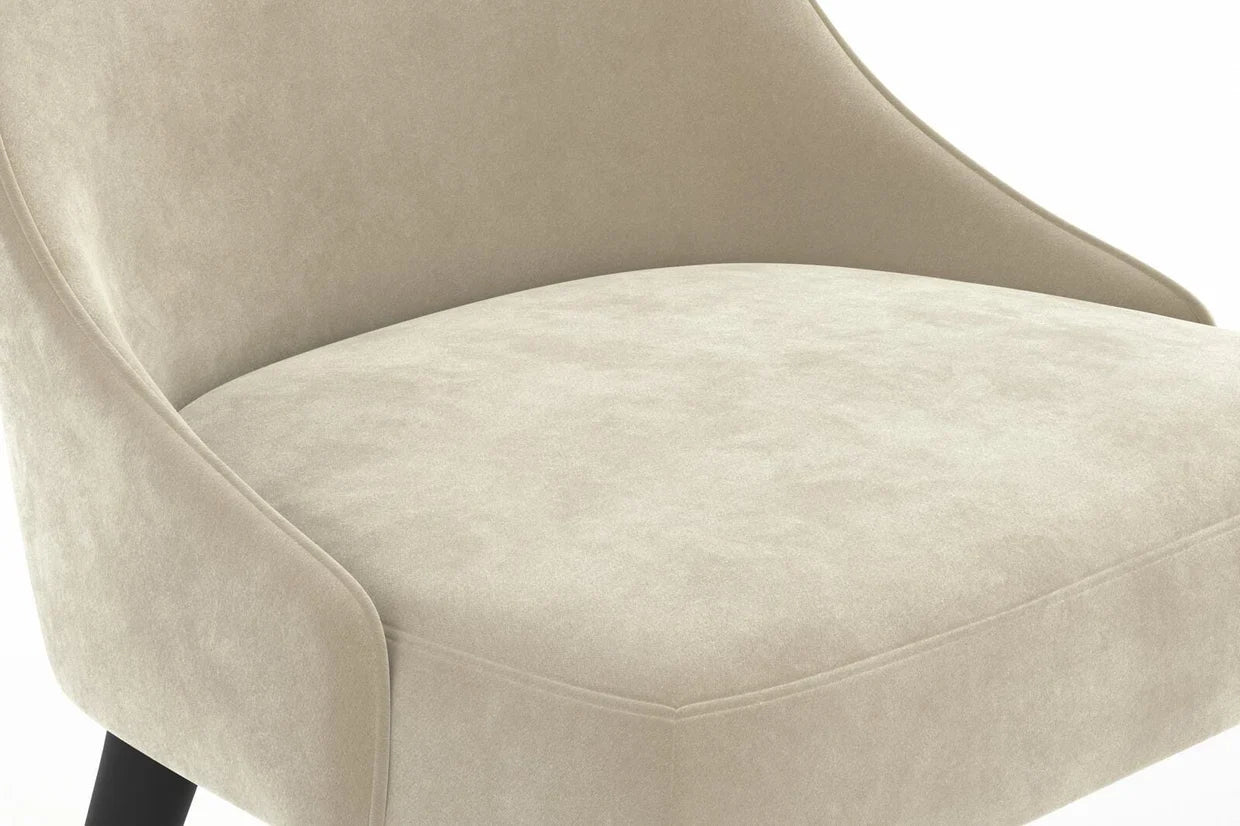 Close-up of a beige upholstered chair with a white background