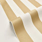 Gold and white striped wallpaper shown in a close-up, rolled view to display its texture and pattern.