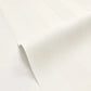 A close-up of a white textured material, possibly wallpaper or a vinyl wrap, shown with a soft fold on a matching white background.