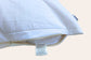White pillow unzipped showing a wise wool cloud wool label