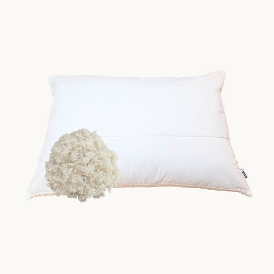 white pillow with wool insert showing