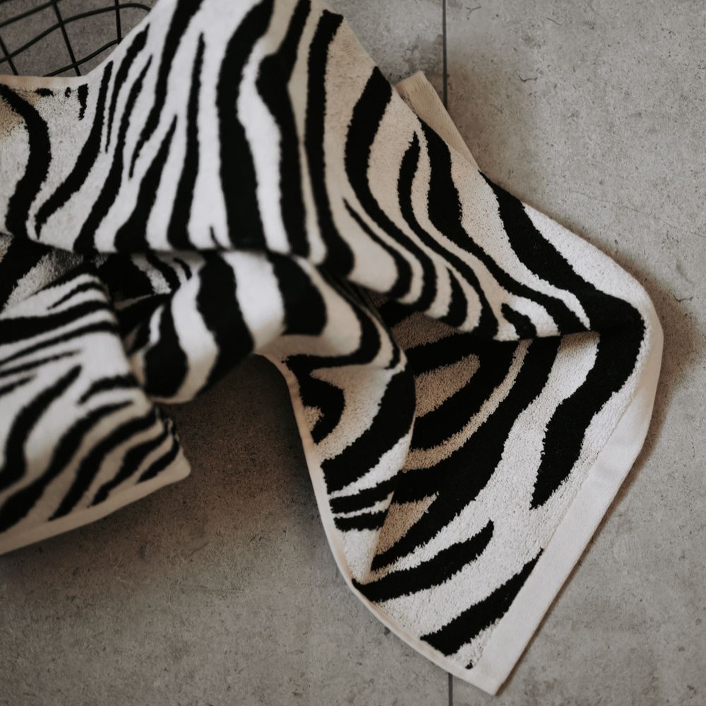 Zebra patterned blanket on a concrete floor