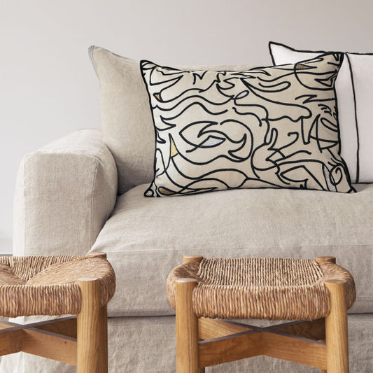 Anamorphose cushion on a sofa