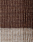 Close-up of a woven textile with vertical ribbed stripes in dark brown, medium brown, tan, and off-white, with a lighter striped border at the bottom.