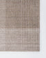 A close-up of a woven rug or textile showing a striped ribbed texture in taupe, beige, and light gray tones, photographed against a plain white background.
