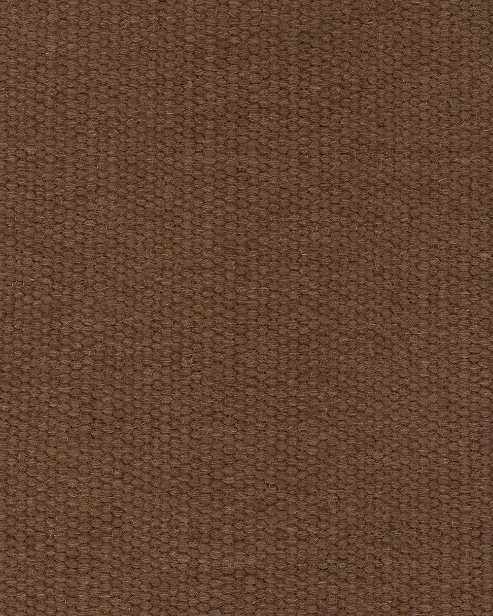 A close-up of a brown woven fabric texture, showing the detailed knit pattern and color.