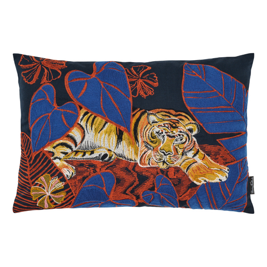 embroidered tiger peaking through foliage and banana leaf with a blue background