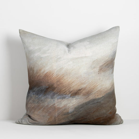 Abstract cushion with windswept sstrokes in blush pink, blue, grey and brown