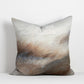 Abstract cushion with windswept sstrokes in blush pink, blue, grey and brown