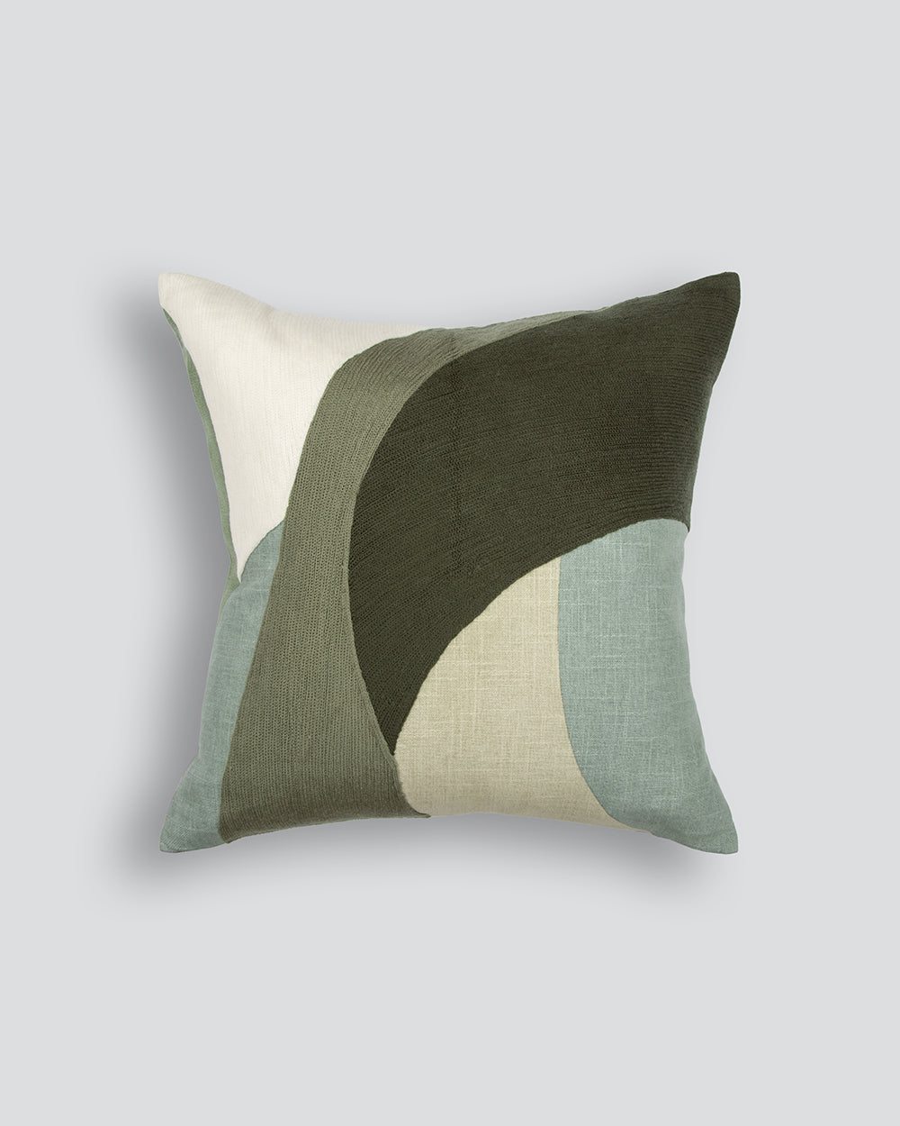 Decorative pillow with geometric pattern on a light gray background