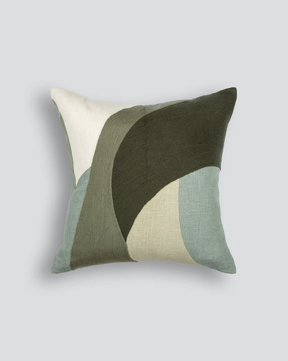 Decorative pillow with geometric pattern on a light gray background