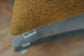 Close-up of a textured surface with a 'KindFace' label.