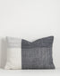 Textured pillow with two-tone design on a light gray background
