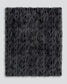Dark gray textured fur throw on a light gray background