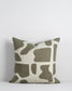 Harper cushion with cream back ground and abstract olive sploges from the Baya Collection