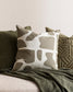 Harper cushion with cream back ground and abstract olive sploges from the Baya Collection