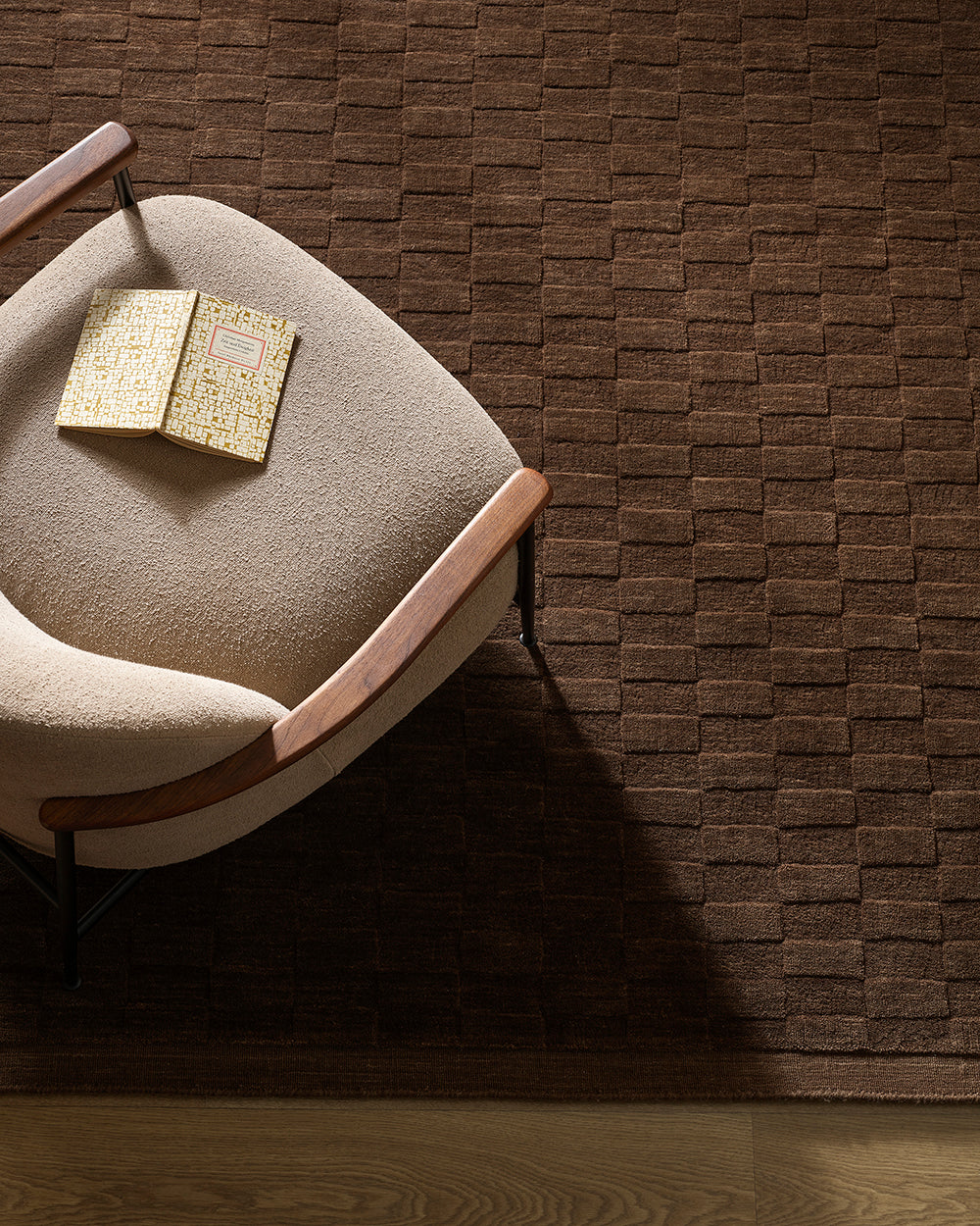 Chair with a  textured brown wall rug