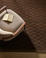 Chair with a  textured brown wall rug