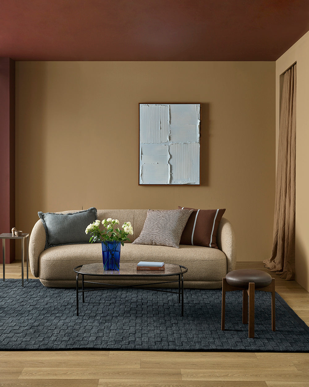 Living room with beige sofa, coffee table, and decorative elements.