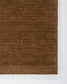 Brown textured rug on a white background