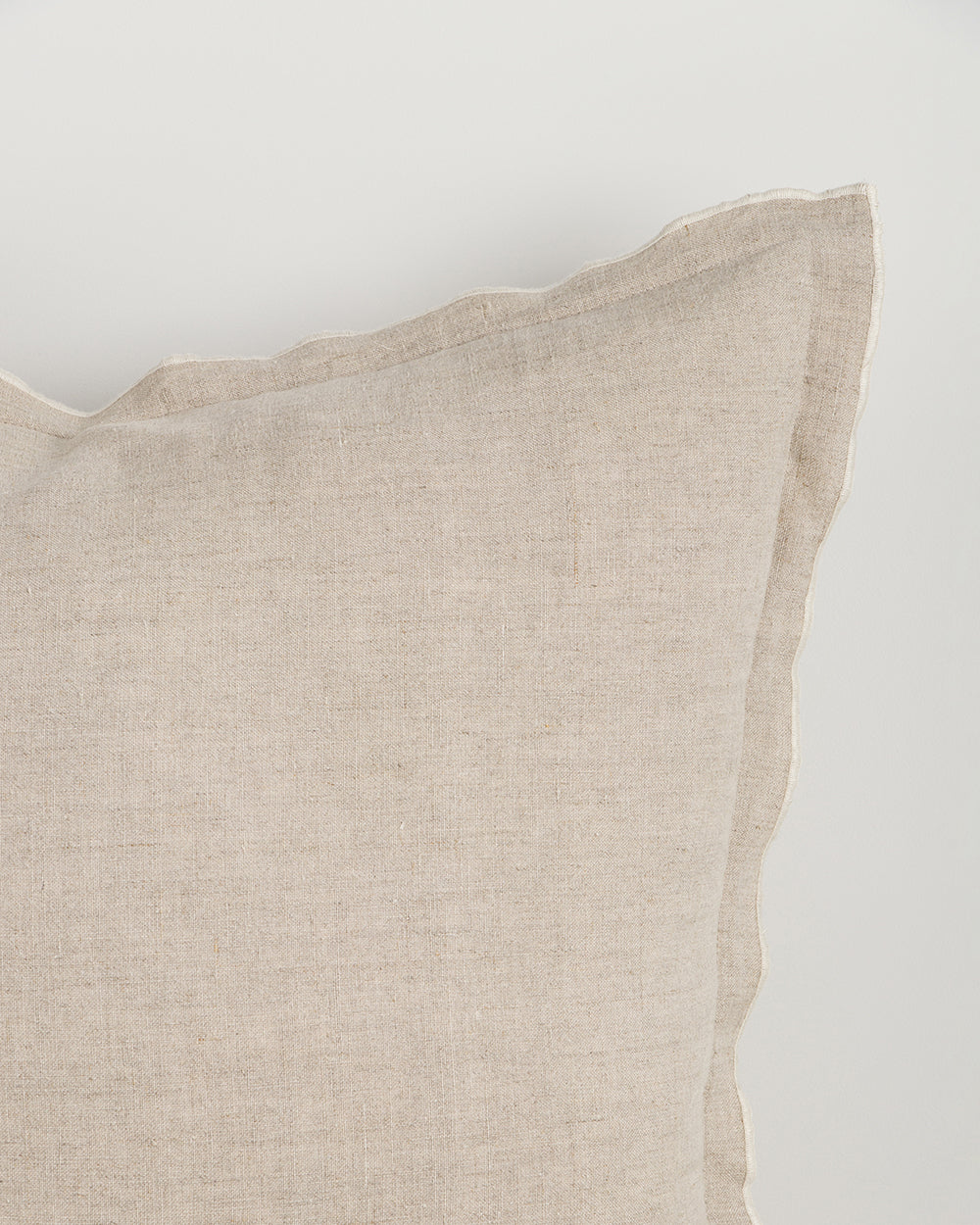 Beige pillow on a white background