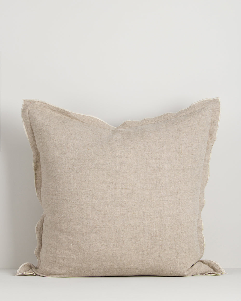 Beige pillow on a light gray background