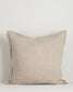 Beige pillow on a light gray background