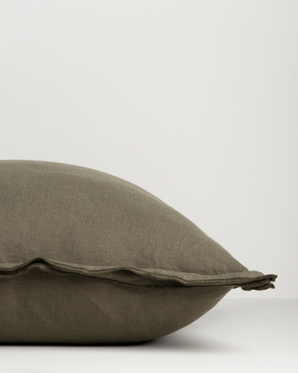 Olive pillow on a white background