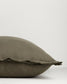 Olive pillow on a white background