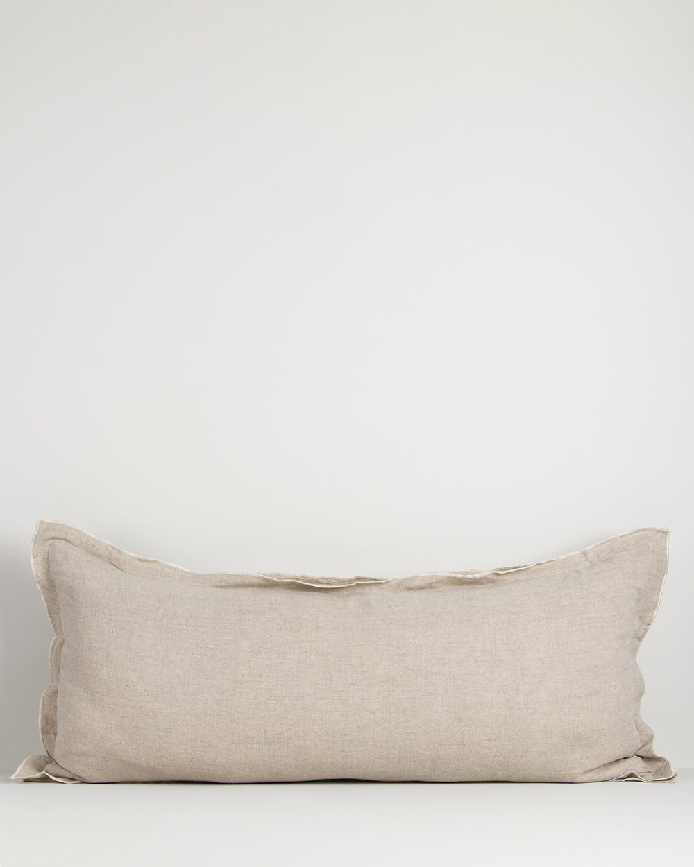 Beige lodge pillow on a white background