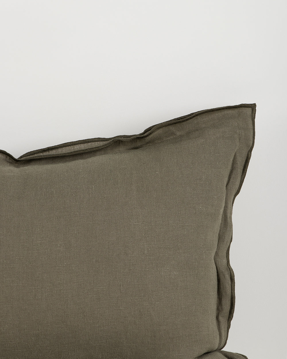 Olive pillow on a white background