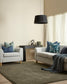 Living room with gray sofa, armchair, and decorative pillows.