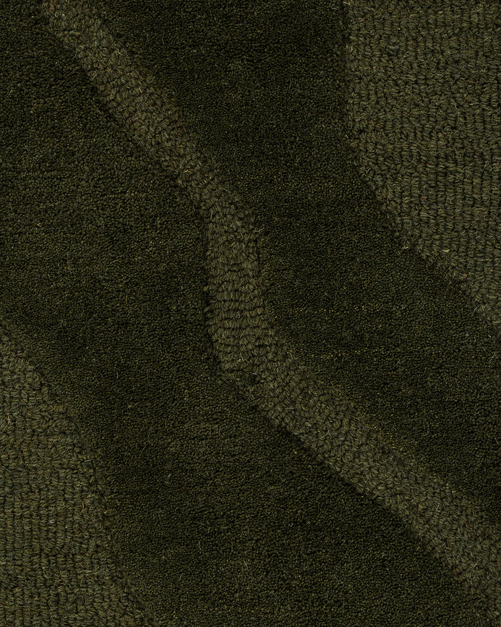 Close-up of a textured green fabric surface