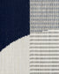 Close-up of fabric with a striped pattern transitioning from dark blue to white.