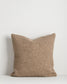 Textured brown pillow on a white background