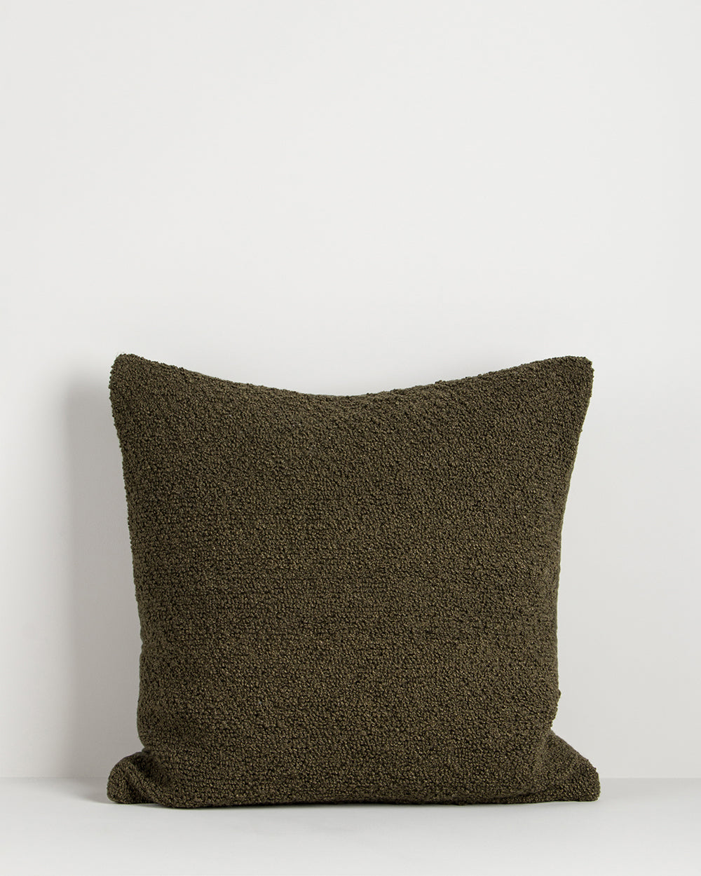 Brown textured pillow on a white background