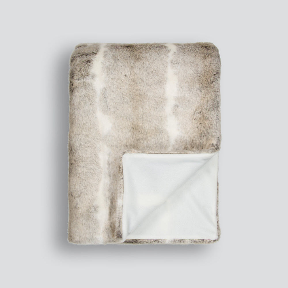 Textured rabbit blanket with a gradient pattern on a light gray background